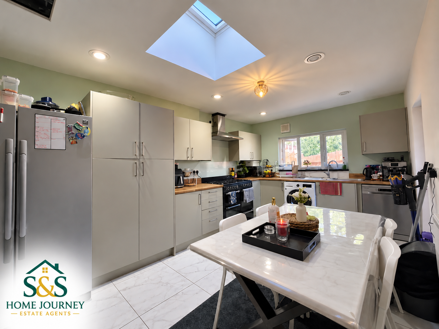 Kitchen and dining table at the eight-bedroom Tyseley home