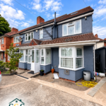 Front bay windows, porch and driveway at the Tyseley home