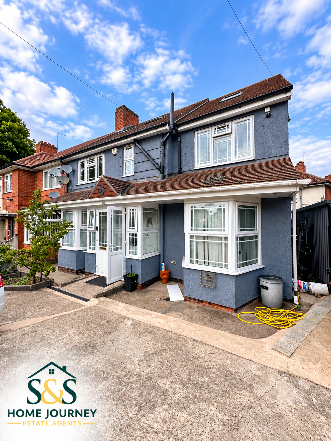 Front bay windows, porch and driveway at the Tyseley home