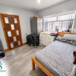 Bedroom with a double bed at the eight-bedroom Tyseley home