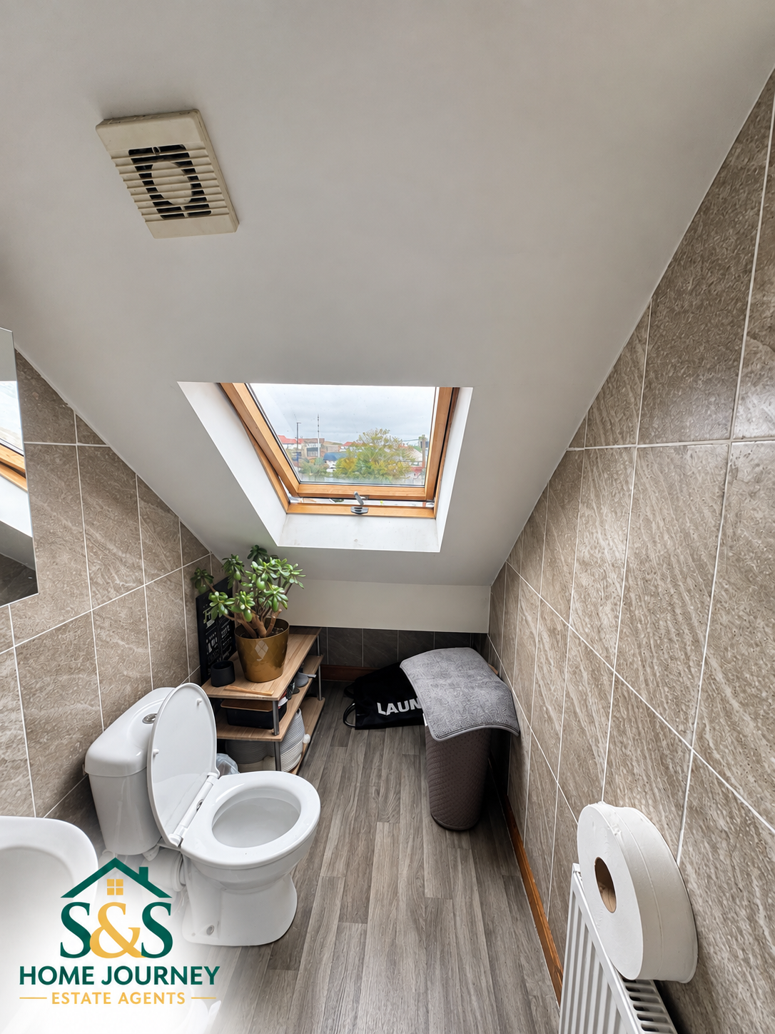 Upper-floor WC with roof window at the Tyseley property